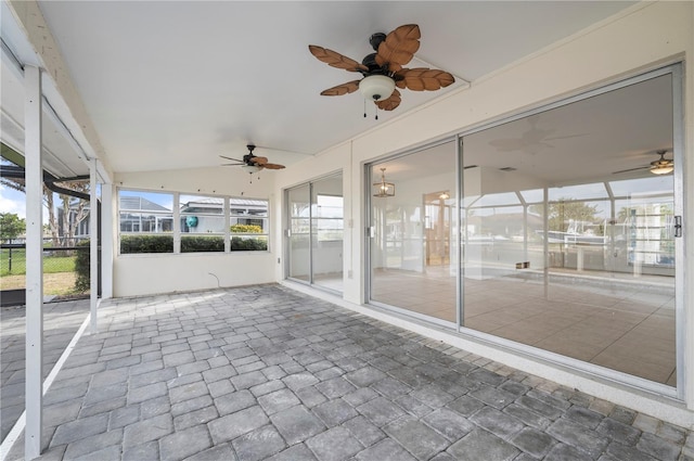 unfurnished sunroom with vaulted ceiling