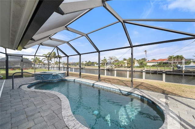 view of pool featuring a lanai, a water view, a patio area, and an in ground hot tub