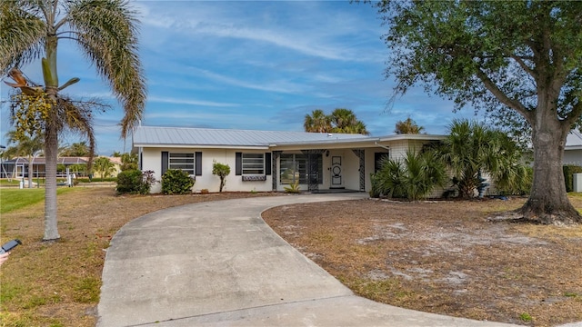 ranch-style house with a carport