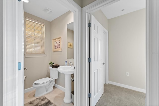 bathroom featuring sink and toilet