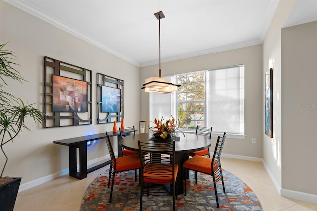 dining area featuring light tile patterned floors and crown molding