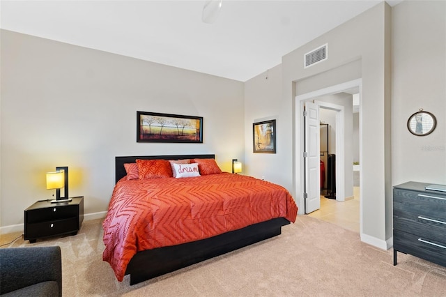 bedroom featuring light colored carpet