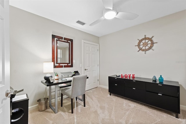 carpeted office featuring ceiling fan