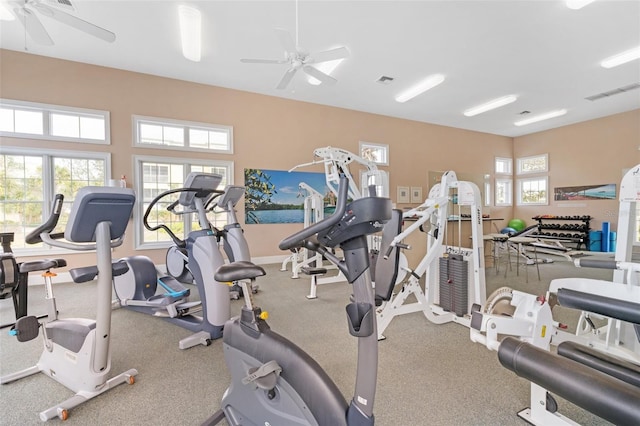 exercise room with ceiling fan