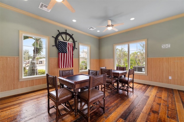 dining room with a healthy amount of sunlight, dark wood-type flooring, and ceiling fan