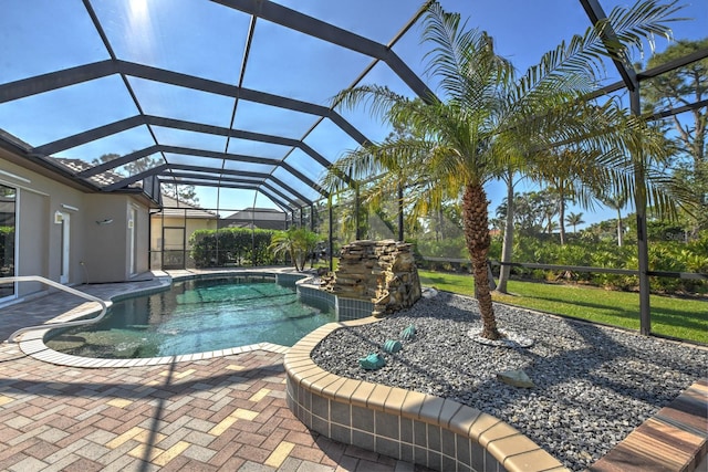 view of swimming pool featuring a lanai and a patio