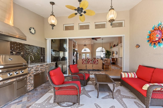 view of patio with an outdoor hangout area, sink, and area for grilling