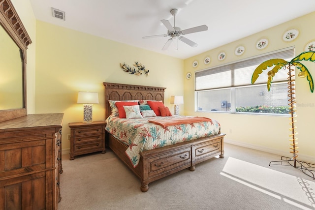 bedroom with light carpet and ceiling fan