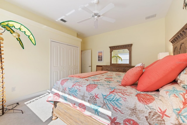 carpeted bedroom with ceiling fan and a closet