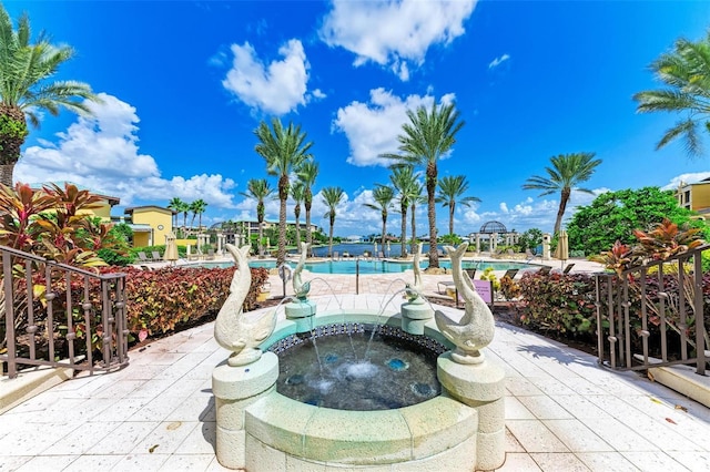 view of pool with an in ground hot tub and a patio area