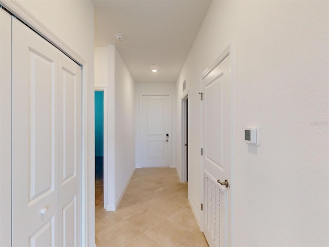 hallway with light tile patterned floors