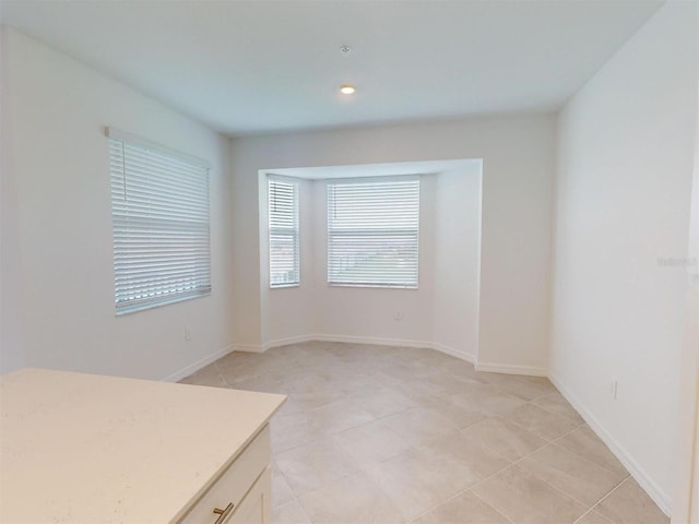 interior space with light tile patterned flooring