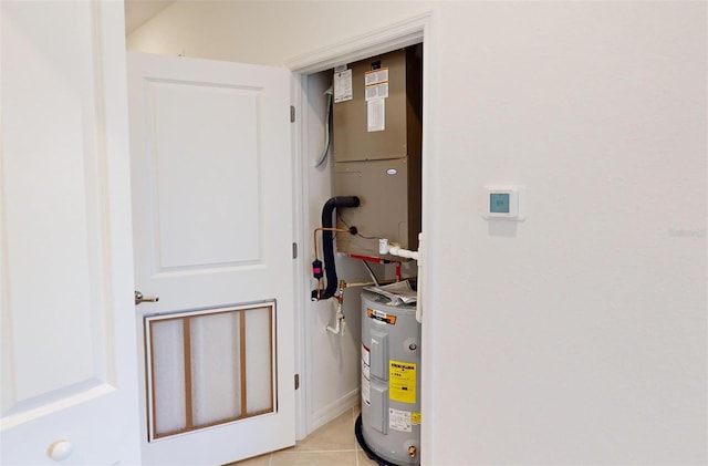 utility room featuring water heater