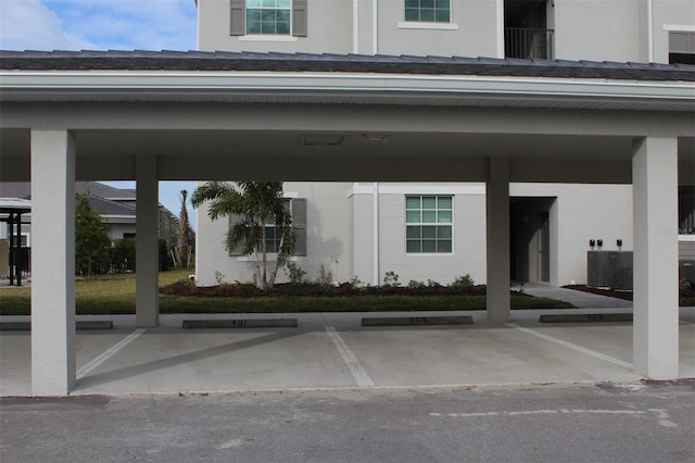 view of vehicle parking featuring a carport