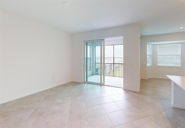 empty room with light tile patterned floors