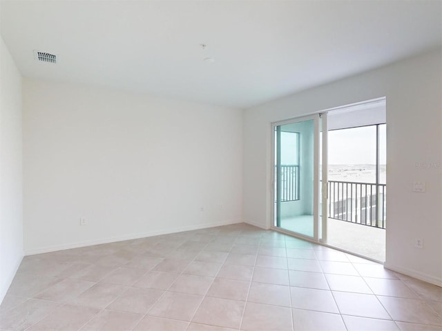 empty room featuring light tile patterned floors