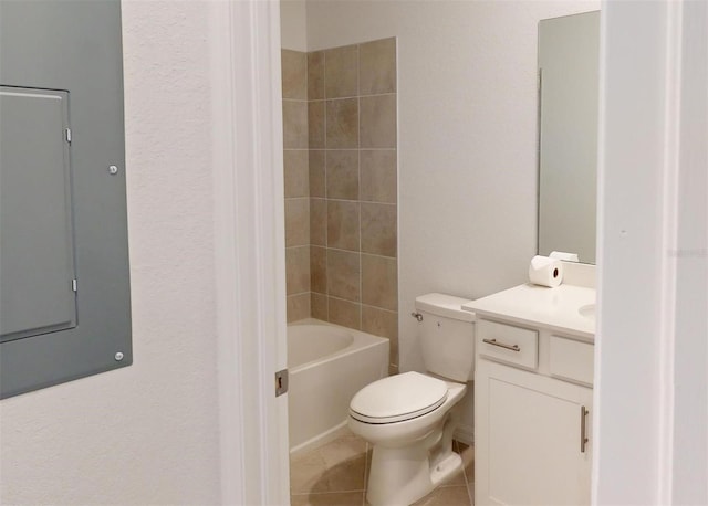 full bathroom with toilet, tiled shower / bath combo, tile patterned floors, electric panel, and vanity