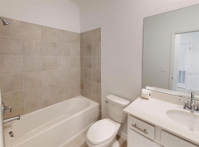 full bathroom with toilet, tiled shower / bath combo, and vanity