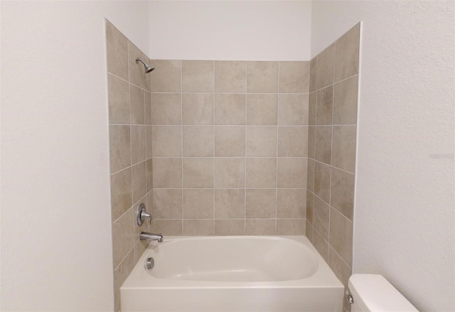 bathroom with toilet and shower / washtub combination