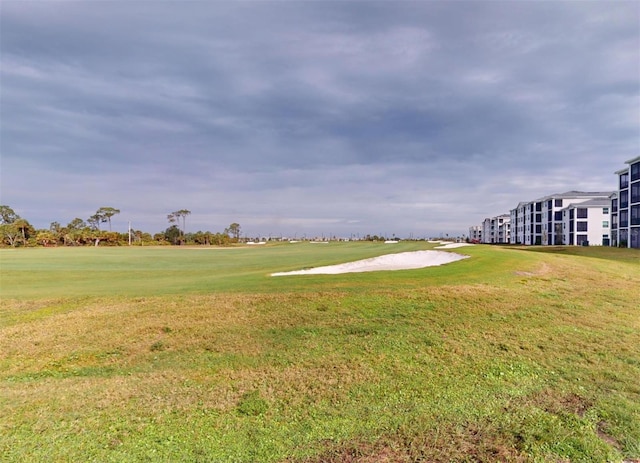 view of property's community featuring a yard