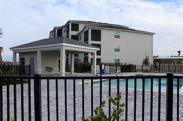 view of pool featuring a gazebo and a patio