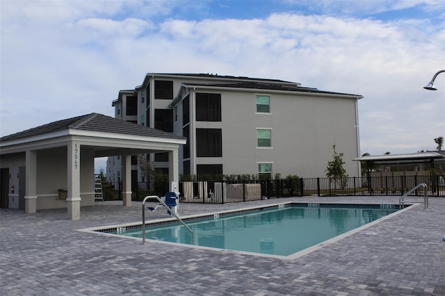 view of swimming pool with a patio