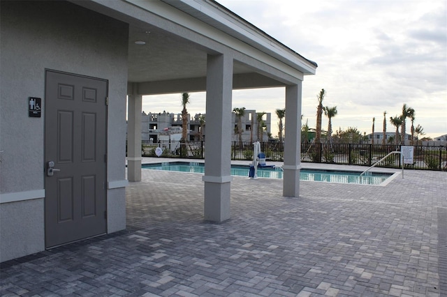 view of swimming pool featuring a patio