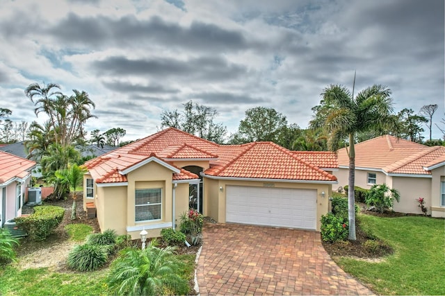 3985 Cape Cole Blvd, Punta Gorda, FL 33955 - mediterranean / spanish home with a garage