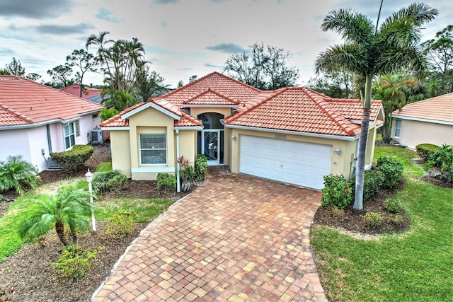 mediterranean / spanish-style house featuring a garage