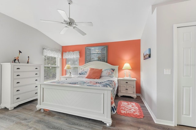 bedroom featuring ceiling fan, wood-type flooring, and lofted ceiling