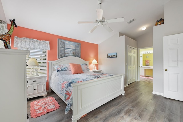 bedroom featuring ceiling fan, a closet, dark hardwood / wood-style flooring, and lofted ceiling