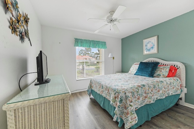 bedroom featuring ceiling fan and dark hardwood / wood-style flooring