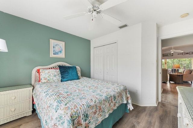 bedroom featuring ceiling fan, a closet, and wood-type flooring