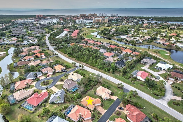 bird's eye view with a water view