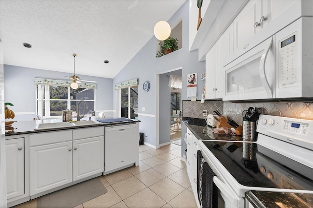 kitchen featuring white cabinetry, hanging light fixtures, white appliances, and light tile patterned flooring