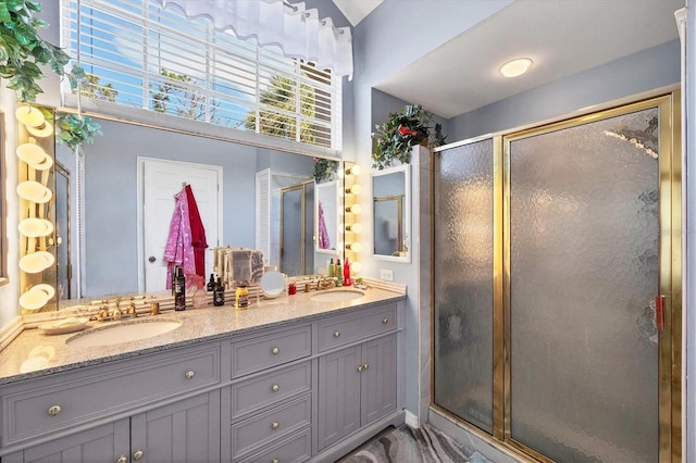 bathroom with vanity and walk in shower