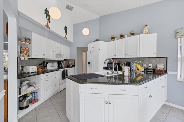 14057 Maxwell Ave, Port Charlotte, FL 33953 - kitchen with open shelves, white appliances, a sink, light tile patterned flooring, and high vaulted ceiling