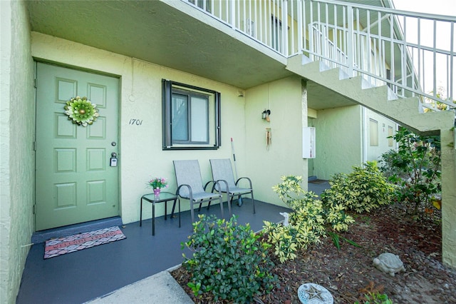 entrance to property with a balcony