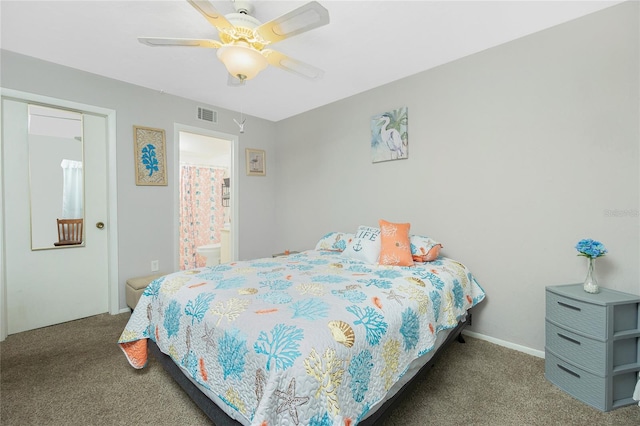 carpeted bedroom with connected bathroom and ceiling fan