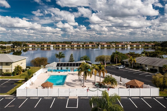 exterior space featuring a water view and a patio area