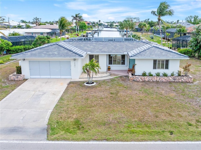 single story home with a lanai, a front lawn, and a garage