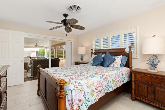 bedroom with ceiling fan, light tile patterned floors, and access to outside