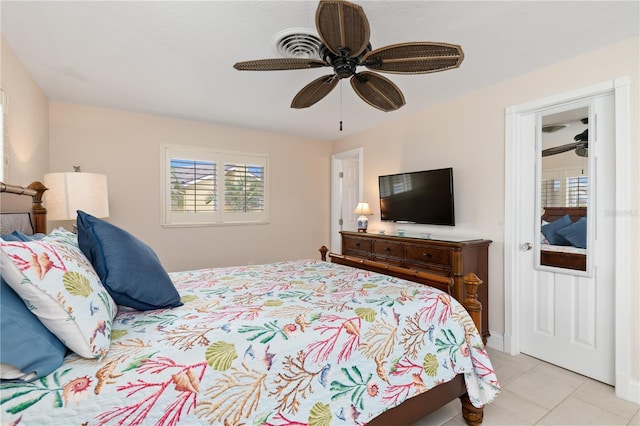 tiled bedroom with ceiling fan