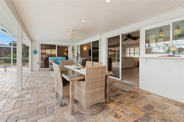 sunroom / solarium with ceiling fan