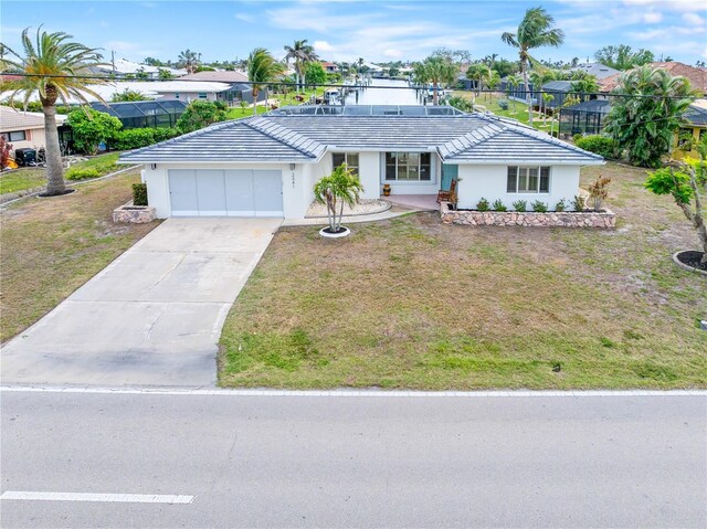 single story home featuring a front yard and a garage