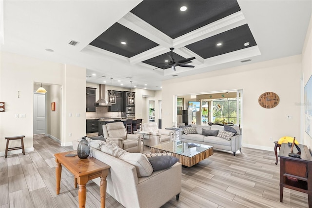 living room with ceiling fan, crown molding, beam ceiling, and coffered ceiling