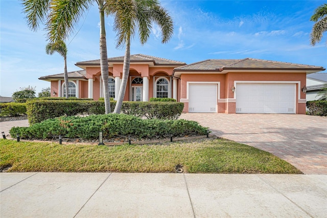 view of front of home with a garage