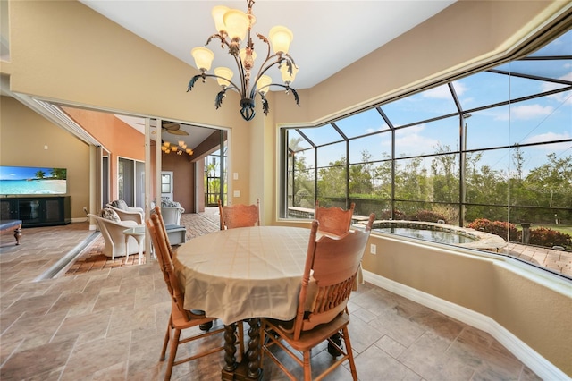 dining room with vaulted ceiling and an inviting chandelier