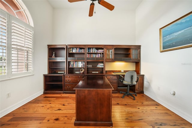 home office with ceiling fan and hardwood / wood-style floors