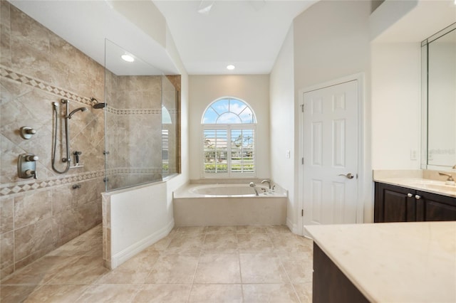 bathroom with vanity, independent shower and bath, and tile patterned flooring